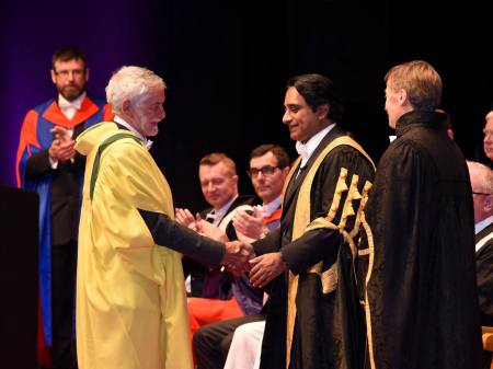 John Francis receiving his Honorary Doctorate from the Chancellor, Sanjeev Bhaskar.